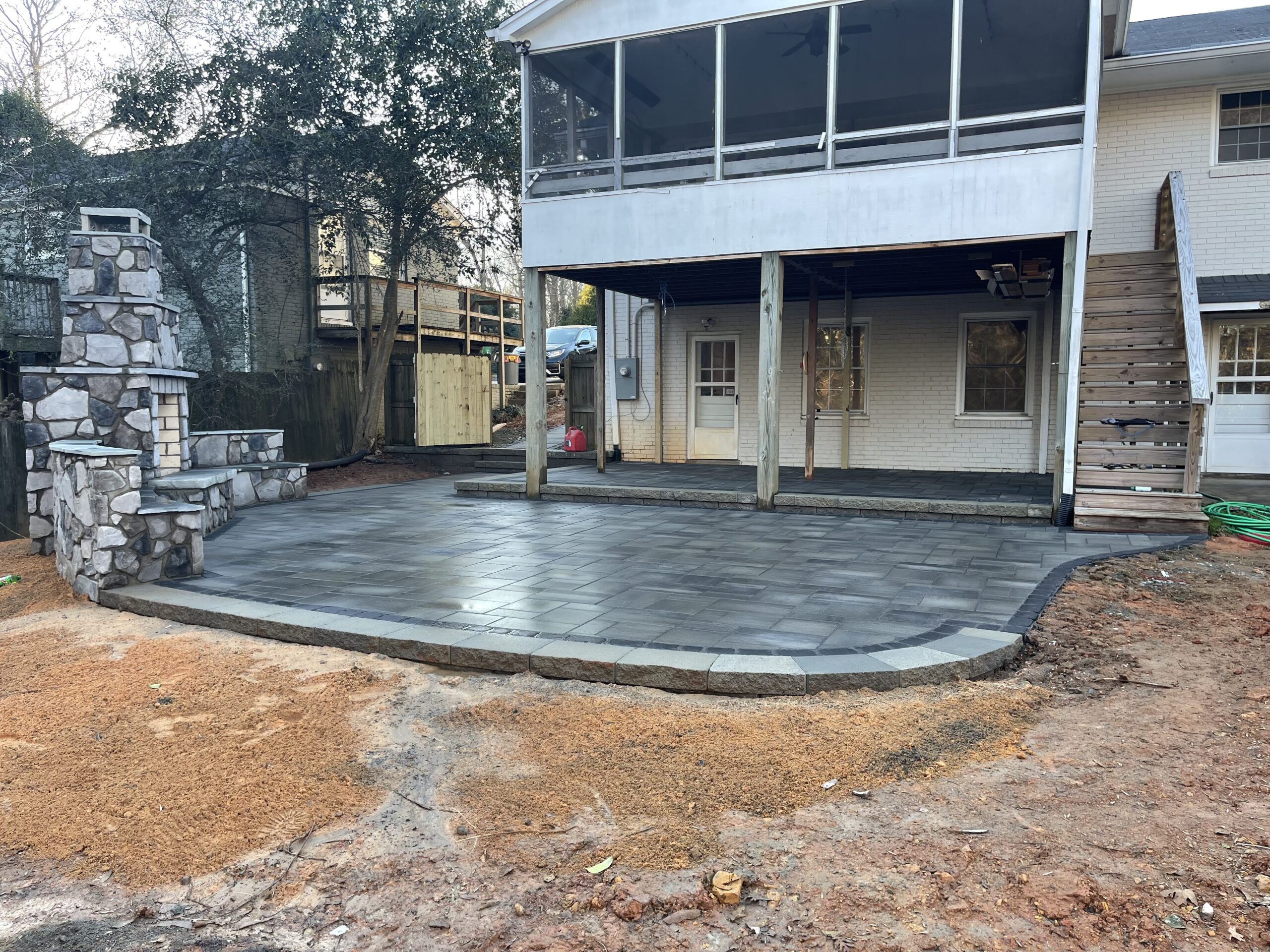 New outdoor patio with outdoor fireplace.