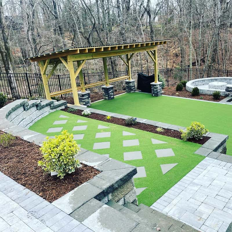 Custom-built retaining wall in Charlotte, NC, showcasing erosion control and landscape enhancement.