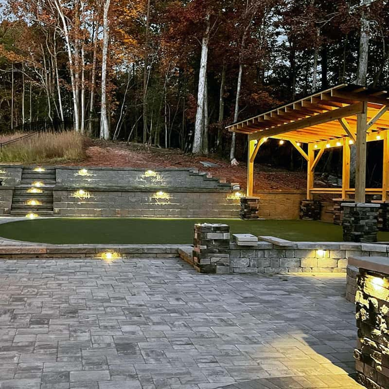 A durable block wall retaining wall installed in Charlotte, NC, for soil retention and landscape appeal.