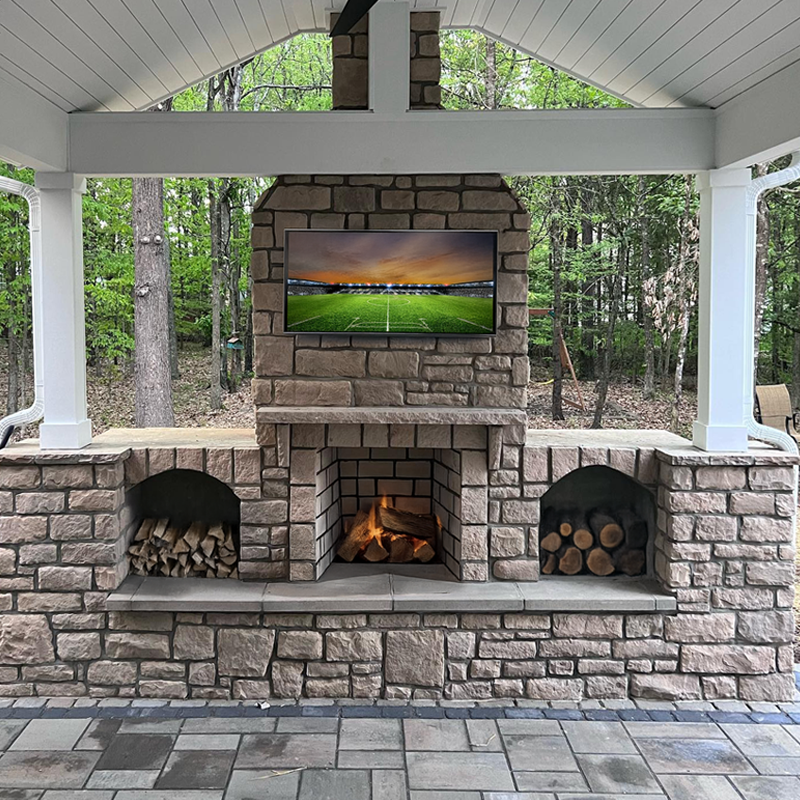 fireplaces-charlotte-nc Custom outdoor fireplace adding warmth and ambiance to a backyard in Charlotte, NC.